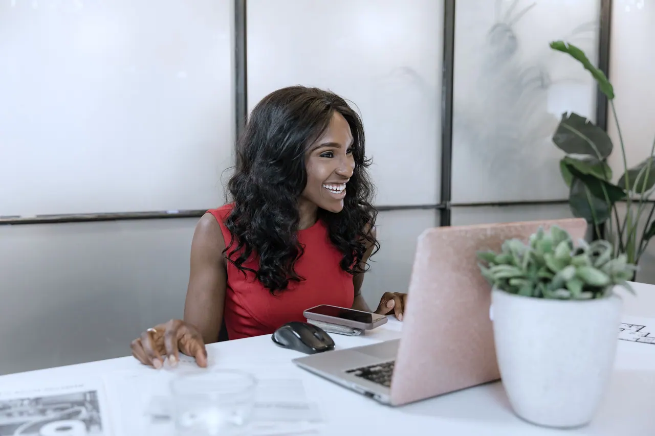 A founder working on her laptop in a bright office