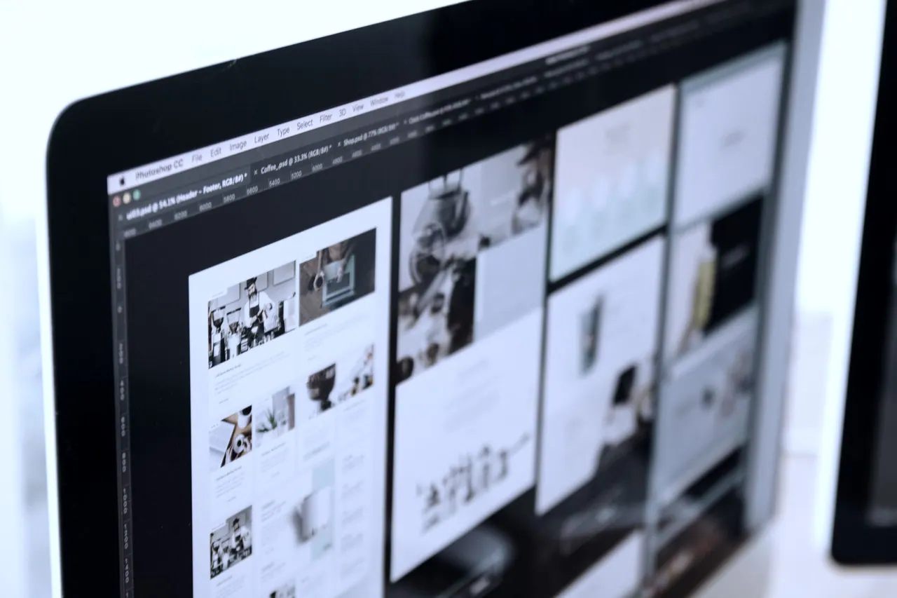 A monitor showing a grid of page designs
